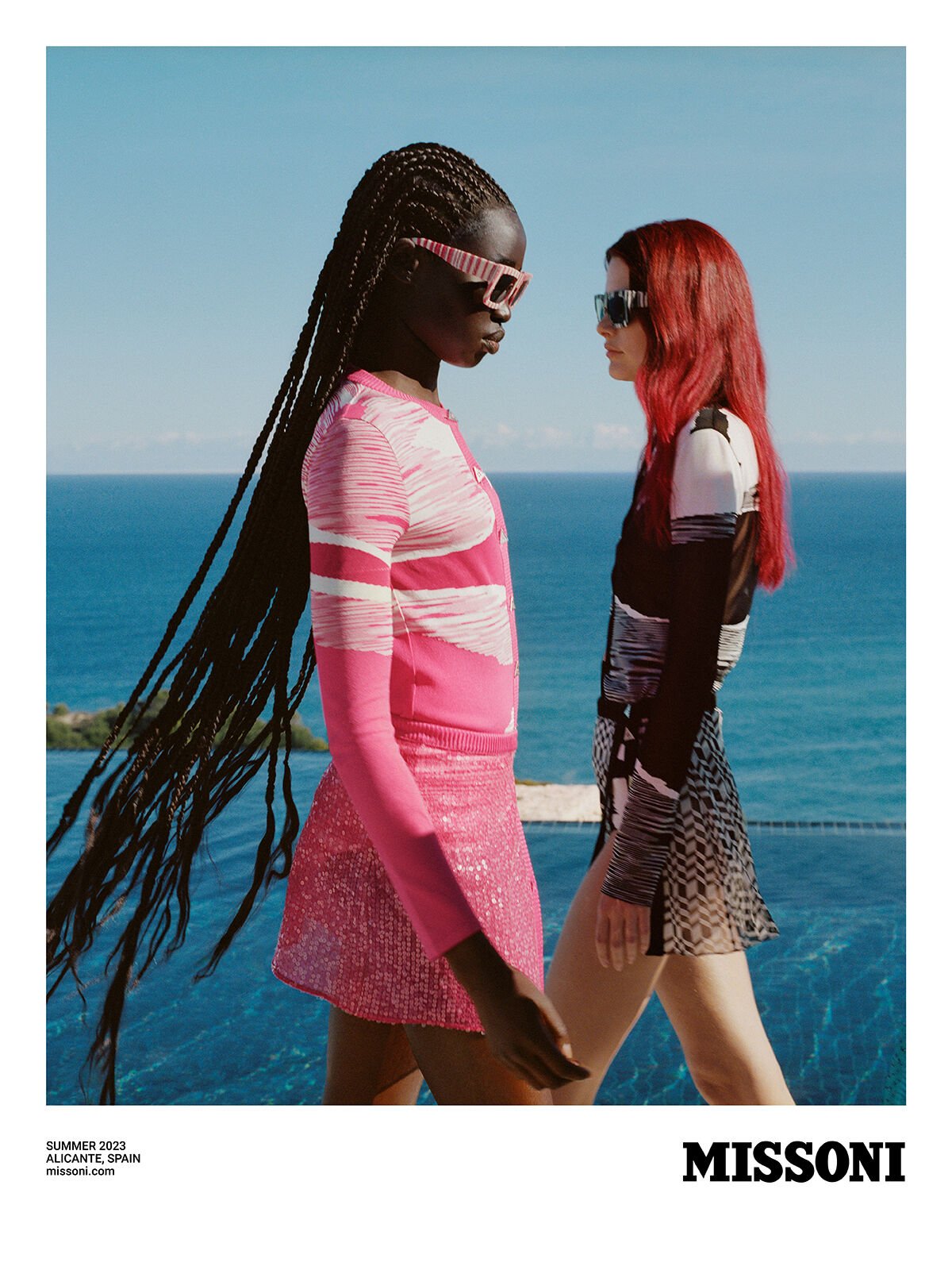 Two models wear different colorful outfits from the new Spring Summer 2023 collection Two models wear different colorful outfits from the new Spring Summer 2023 collection